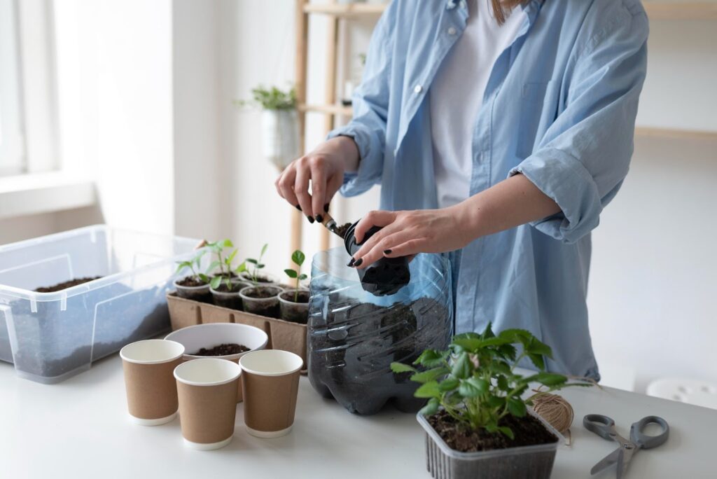 Woman having a sustainable garden indoors